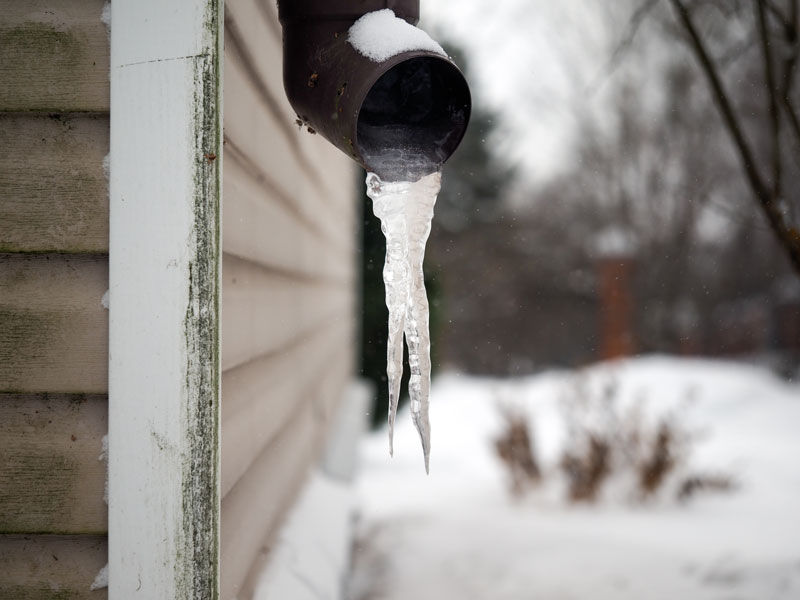 exterior of house with a frozen pipe